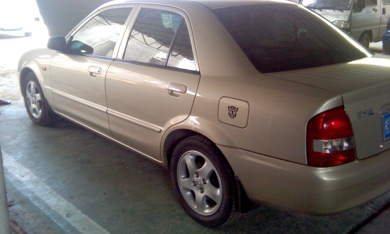 合浦出台04年进口发动机马自达323,4万